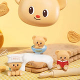Officially licensed bakery-themed Butterbear collectible mini figures holding baking tools, wearing aprons, and posing with kitchen accessories