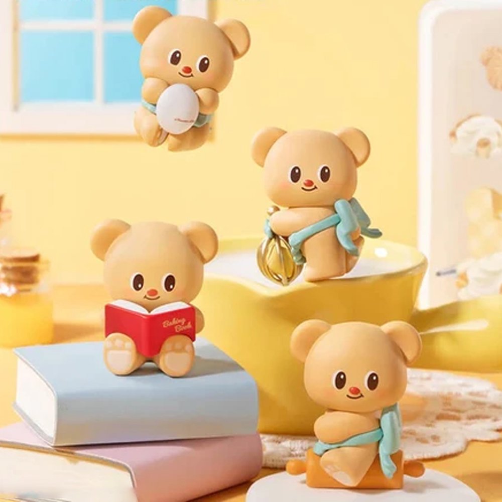 Officially licensed bakery-themed Butterbear collectible mini figures holding baking tools, wearing aprons, and posing with kitchen accessories