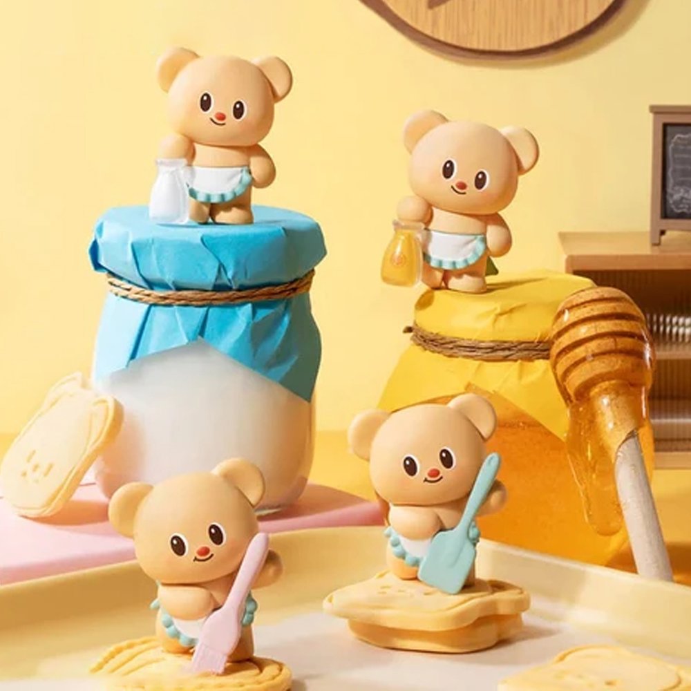 Officially licensed bakery-themed Butterbear collectible mini figures holding baking tools, wearing aprons, and posing with kitchen accessories