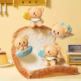 Officially licensed bakery-themed Butterbear collectible mini figures holding baking tools, wearing aprons, and posing with kitchen accessories