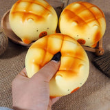 Soft capybara-shaped melon pan bread squishy toys with golden-brown baked textures and minimalist facial features