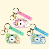 "Official Chiikawa Camera Projector Keychains set of 3 in Pink (Chiikawa), Green (Usagi), and Blue (Hachiware) with matching name straps.