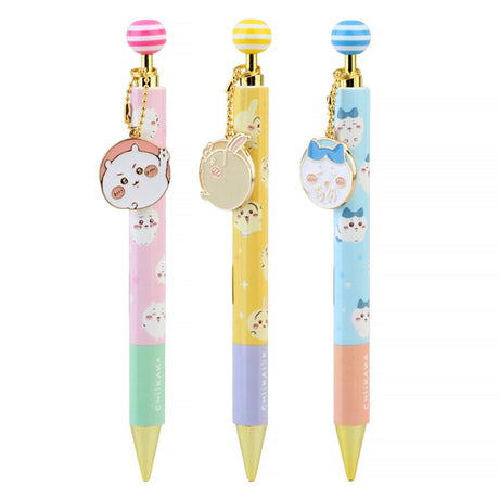 An official licensed collection of Chiikawa mechanical pencils in pink, blue, and yellow. Each pencil features a matching striped ball topper and a dangling enamel character charm of Chiikawa, Hachiware, or Usagi.