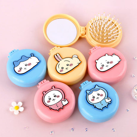 An officially licensed collection of colorful Chiikawa 2-in-1 character mirror & hair brush sets in pink, blue, and yellow.