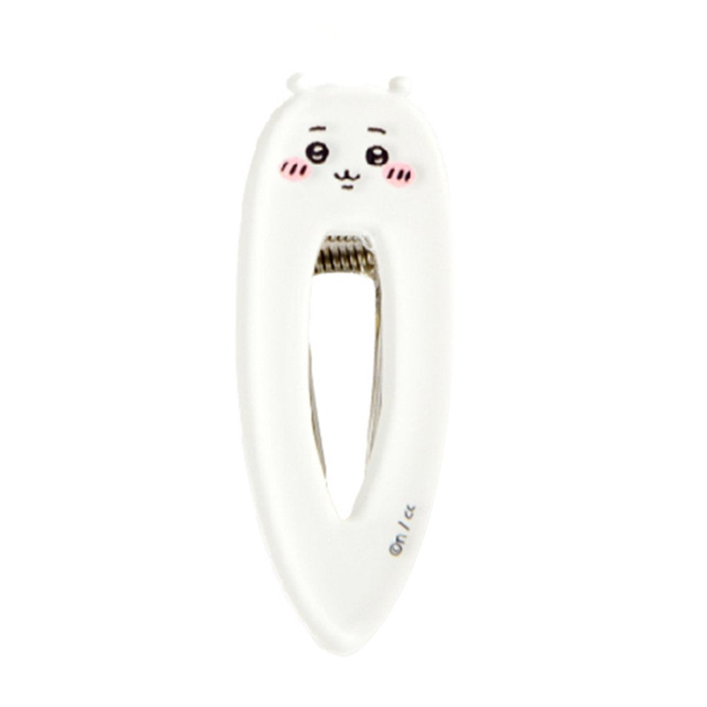White teardrop-shaped Chiikawa character hair clip featuring a minimalist blushing face and a sturdy metal spring-loaded mechanism.
