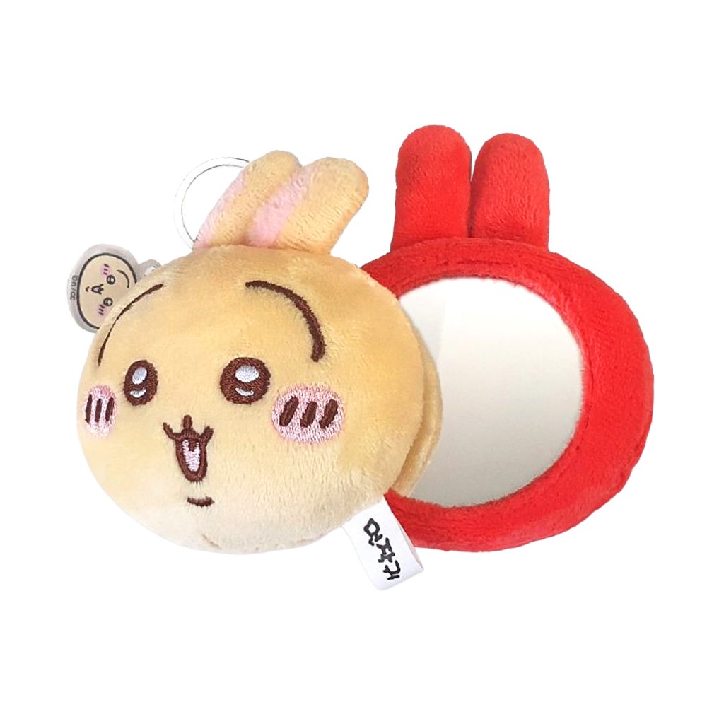 The officially licensed Usagi plush mirror keychains featuring two circular plush heads, one yellow and one red, show Usagi's embroidered face and long ears. The reverse side of the plush, revealing a built-in circular vanity mirror with a metal ring and a small character-themed acrylic charm.