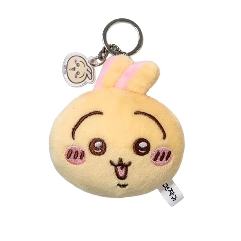 The officially licensed Usagi plush mirror keychains featuring two circular plush heads, one yellow and one red, show Usagi's embroidered face and long ears. The reverse side of the plush, revealing a built-in circular vanity mirror with a metal ring and a small character-themed acrylic charm.