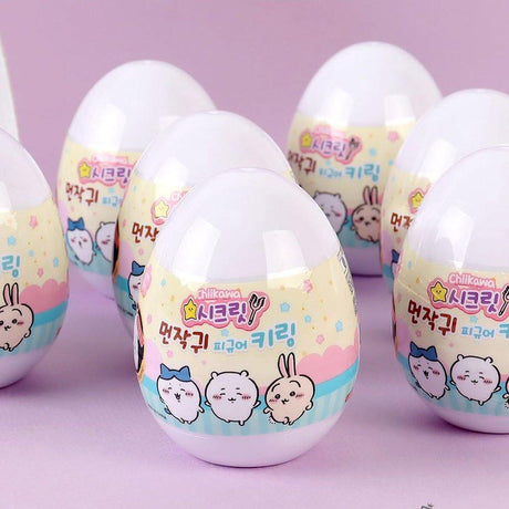 Pastel-colored toy eggs with Chiikawa, Hachiware, and Usagi characters on a pink background