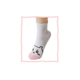 Featuring the pairs of officially licensed Chiikawa white crew-length socks, pink one surrounded by small pink-and-white flowers and blue one surrounded by blue-and-yellow flowers.