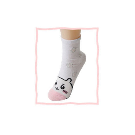 Featuring the pairs of officially licensed Chiikawa white crew-length socks, pink one surrounded by small pink-and-white flowers and blue one surrounded by blue-and-yellow flowers.