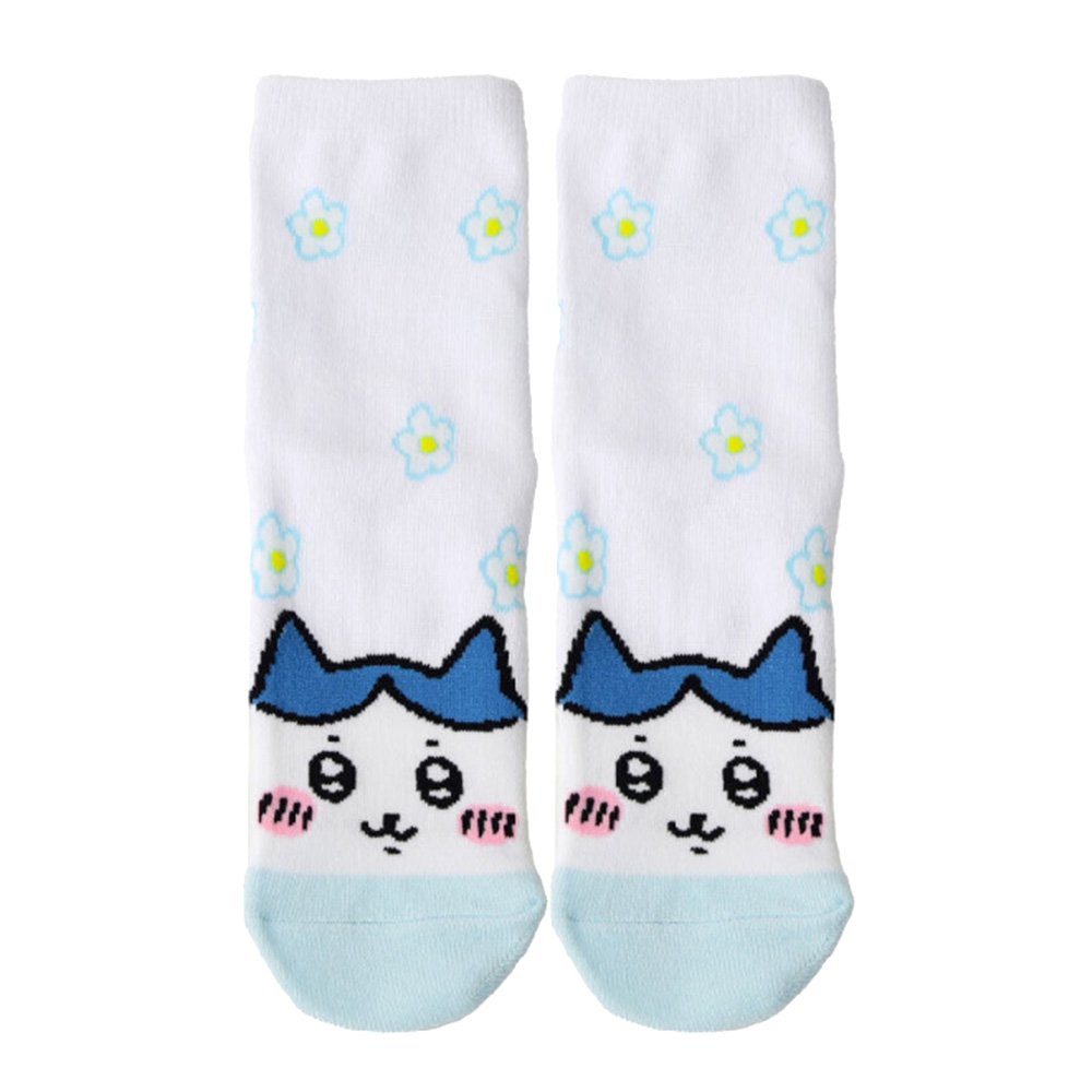 Featuring the pairs of officially licensed Chiikawa white crew-length socks, pink one surrounded by small pink-and-white flowers and blue one surrounded by blue-and-yellow flowers.