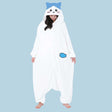 Official SAZAC Chiikawa Hachiware Kigurumi Vol. 2 Costume Onesie Jumpsuit worn by a model. Features a soft white fleece body, Hachiware face hood with blush details, and the upgraded blue fish pochette pocket embroidery. Perfect for Halloween costumes, cozy sleepover nights, and cosplay party loungewear for anime fans
