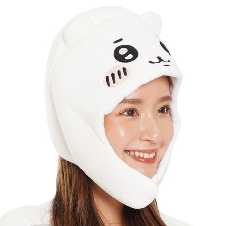 An officially licensed white Chiikawa plush character hat with embroidered eyes, blushing cheeks, and long ear flaps.