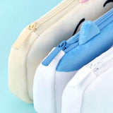 Three officially licensed plush Chiikawa character pencil cases featuring: the yellow-colored with Usagi's face and long ears; the white with Chiikawa's face; the white and blue with Hachiware's face and blue ears. Each pouch features embroidered eyes, pink cheeks, and a top zipper.