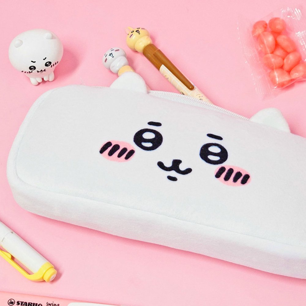 Three officially licensed plush Chiikawa character pencil cases featuring: the yellow-colored with Usagi's face and long ears; the white with Chiikawa's face; the white and blue with Hachiware's face and blue ears. Each pouch features embroidered eyes, pink cheeks, and a top zipper.