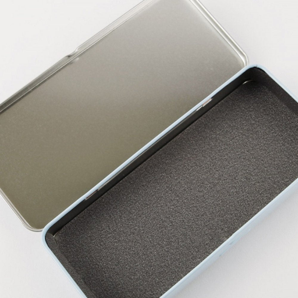 Two rectangular tin pencil cases featuring officially licensed Chiikawa artwork. One is light blue with white polka dots showing Chiikawa and a yellow claw machine hand. The other one has a pink-to-purple sunset gradient showing Chiikawa and Hachiware sitting on stumps and drinking.