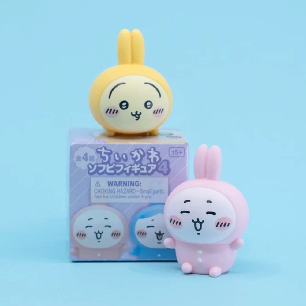 Officially licensed Chiikawa soft vinyl figures featuring Chiikawa, Hachiware, Momonga, and Usagi wearing colorful bunny-ear outfits