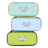A set of three officially licensed Chiikawa hard-shell pencil cases in mint green, blue gingham, and lime green featuring the characters Chiikawa, Hachiware, and Usagi. Each case displays a high-quality character illustration with a sturdy zip-around closure.