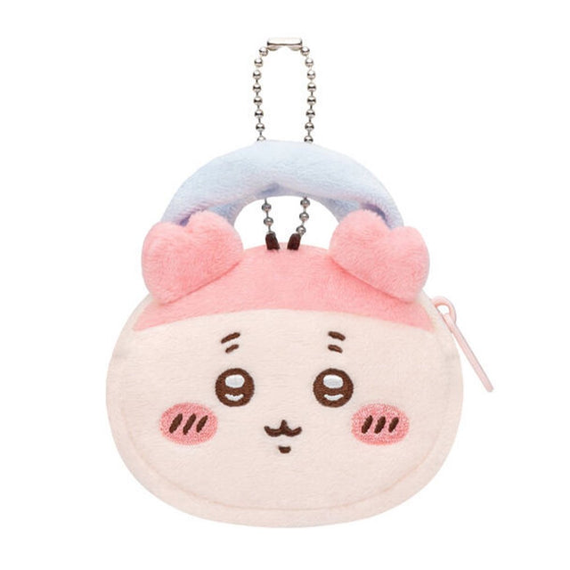 An officially licensed Chiikawa and Friends fluffy mini pouch keychain, featuring the light pink, round pouch features Kani's face with embroidered details, pink plush ears, and a silver ball chain for hanging.