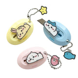 Three officially licensed Chiikawa mini retractable utility knives in yellow, light blue, and pink. Each oval-shaped cutter features a 3D-style character (Usagi, Hachiware, or Chiikawa) in a laying down pose.