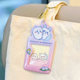 Colorful, officially licensed Chiikawa photo frame keychains featuring pastel gradients, character illustrations, and transparent window slots. Gold keyrings and lobster clasps are attached at the top of each charm holder.