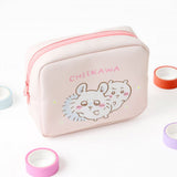 A pastel pink square cosmetic pouch featuring officially licensed Chiikawa, Momonga, Hachiware, and Usagi character art. The pouch has a soft, textured finish and a sturdy zipper, designed for portable storage of small items.
