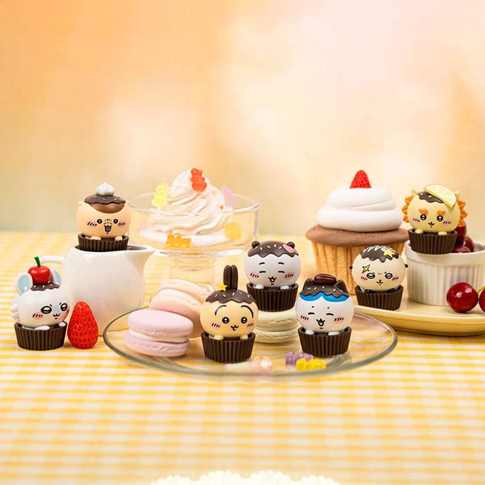 An official licensed collection of Chiikawa mystery Sweet Series blind boxes featuring brown and secret pink cupcake-themed packaging. Characters like Chiikawa, Hachiware, and Usagi are styled as cupcakes with frosting and sprinkles.