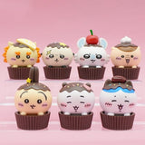 An official licensed collection of Chiikawa mystery Sweet Series blind boxes featuring brown and secret pink cupcake-themed packaging. Characters like Chiikawa, Hachiware, and Usagi are styled as cupcakes with frosting and sprinkles.