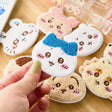 Officially licensed Chiikawa collection of eight fuzzy, plush-embroidered ticochi character face magnet blind box featuring Chiikawa, Hachiware, Usagi, and friends
