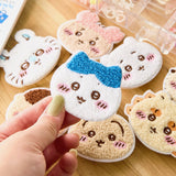 Officially licensed Chiikawa collection of eight fuzzy, plush-embroidered ticochi character face magnet blind box featuring Chiikawa, Hachiware, Usagi, and friends

