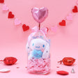 Official Sanrio Cinnamoroll Valentine's Day Plush Gift Set in a clear ribbon package with a red heart balloon. Includes a small Cinnamoroll  holding a pink heart and a collectible themed box, perfect for Kawaii aesthetic gift ideas.
