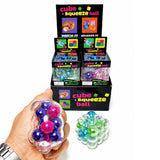 Clear cube-shaped squishy stress balls filled with colorful metallic orbs in purple, pink, green, and blue