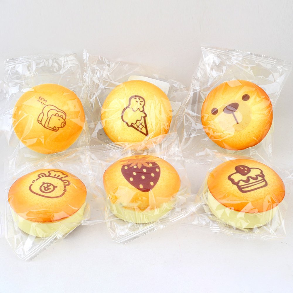 Custard Bun Squishy toys styled like golden baked custard bread with printed bear and dessert illustrations