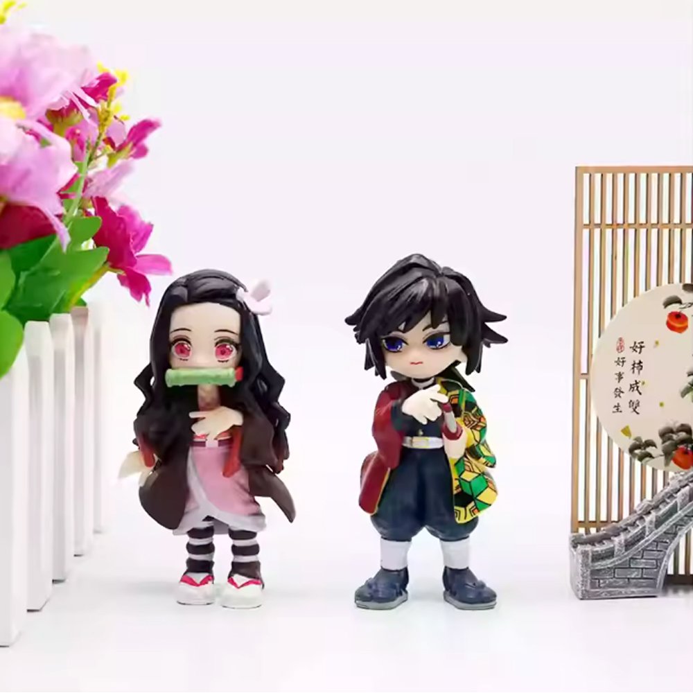 A collection of six officially licensed Demon Slayer figures, featuring Tanjiro, Nezuko, Zenitsu, Inosuke, Giyu, and Rui in their signature outfits.