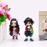 A collection of six officially licensed Demon Slayer figures, featuring Tanjiro, Nezuko, Zenitsu, Inosuke, Giyu, and Rui in their signature outfits.