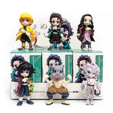 A collection of six officially licensed Demon Slayer figures, featuring Tanjiro, Nezuko, Zenitsu, Inosuke, Giyu, and Rui in their signature outfits.