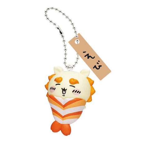 Front view of the officially licensed Shisa shrimp sushi keychain from the Chiikawa blind box series. Yellow-maned Shisa with a striped orange shrimp (Ebi) tail body, featuring a silver ball chain and wooden tag