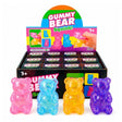 Translucent gummy bear-shaped squishy stress toys filled with sparkling glitter in pink, blue, yellow, and purple