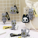 Plush keychains with Black cat design on a white grid background, featuring the brand 'Hakongee'.