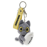 black cat plush keychain with yellow tag on a white background