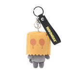 A grumpy Hakongee grey cat plush keychain wearing a brown paper bag over its head, officially licensed and made by WSL