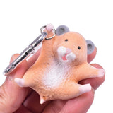 Officially licensed Hanging Hamster mini figure keychain charm in a dangling pose shown attached to a carabiner clip