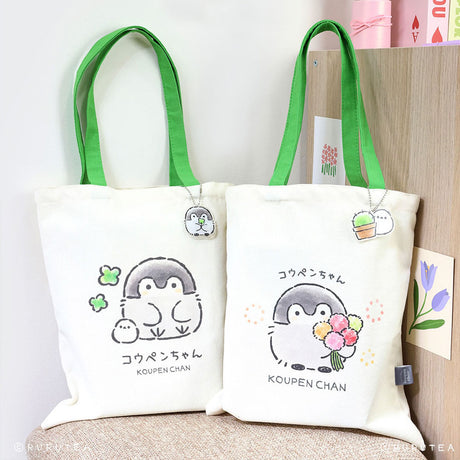 Koupen Chan Tote Bags : Official licensed Koupen Chan canvas tote bags with green handles. One features the penguin with clovers, the other with a flower bouquet.
