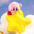 An officially licensed Kirby's Dream Land plush toy featuring a pink Kirby gripping the top of a fluffy yellow star plush