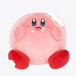 A plush toy depicting the character Kirby from the Nintendo series, showing a pink round body with facial features and red boots.