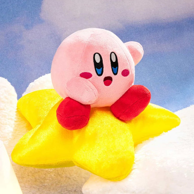 An officially licensed Kirby's Dream Land plush toy featuring a pink Kirby sitting on top of a fluffy yellow star plush