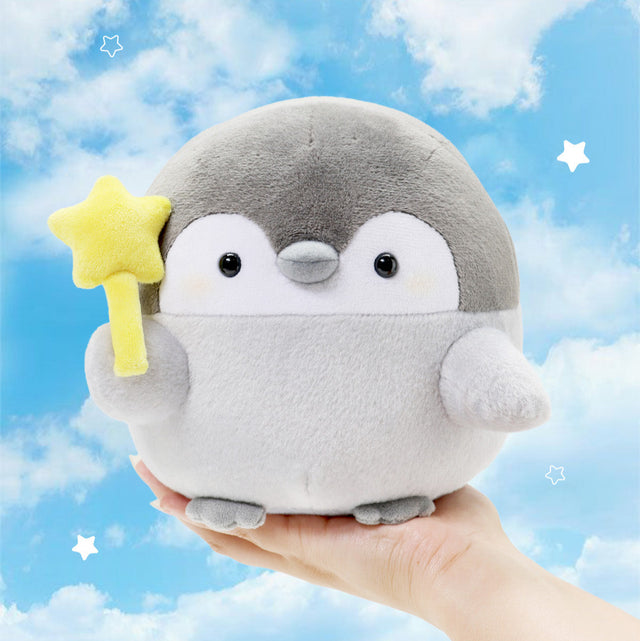 Star Wand Penguin Plush: Person holding a Koupen Chan Penguin Plush 6 inch holding a yellow Star Wand. Official licensed toy, made from soft Polyester Fiber.