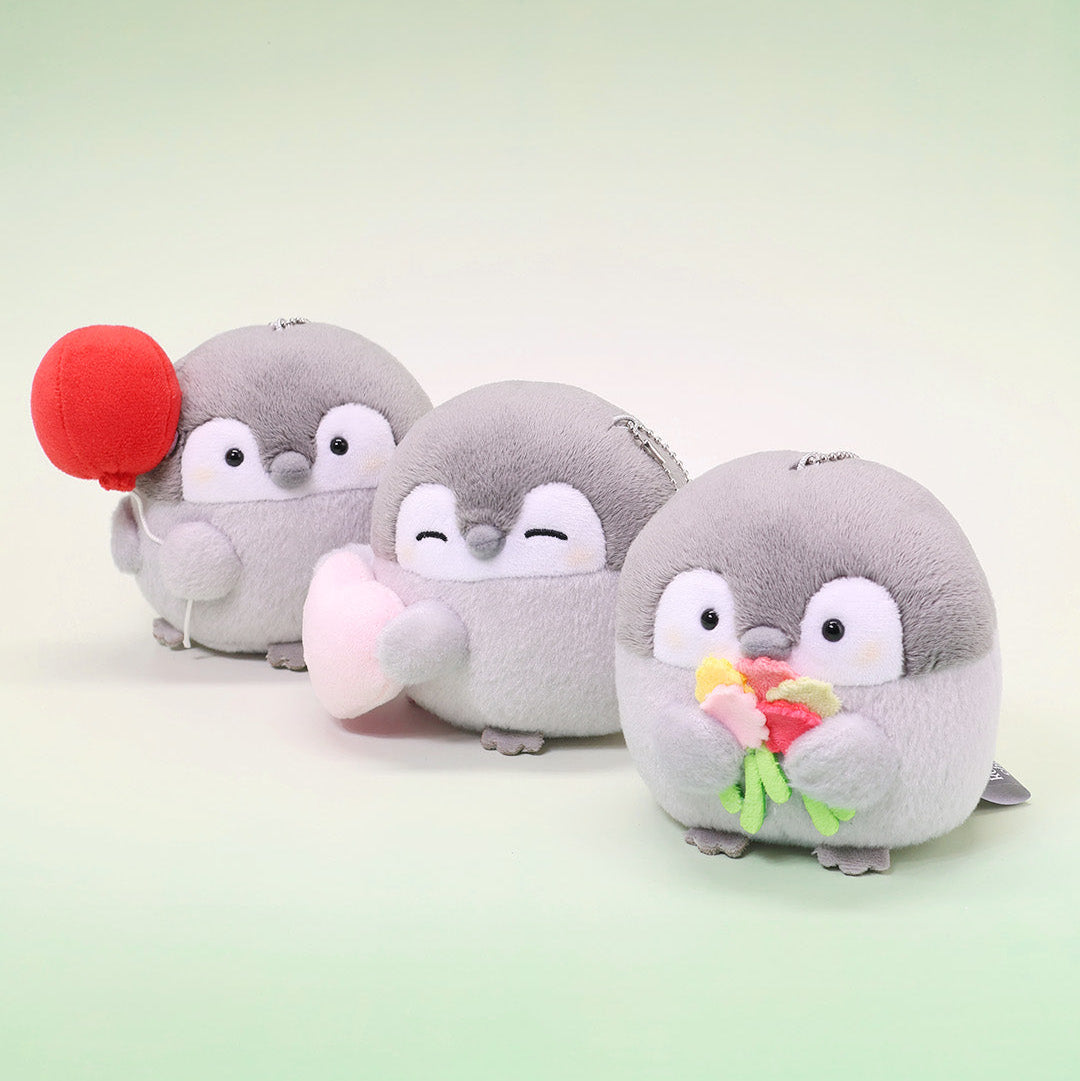 Penguin Plush 4 Inch Keychain: Official licensed Koupen Chan plush, Three plush penguin toys with a red balloon, pink heart and flowers bouquet  on a green background