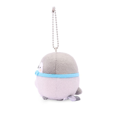 A collection of six officially licensed Koupen Chan plush keychains, each featuring the small grey penguin holding a different dessert like a cupcake or pretzel. Every plush includes a colorful bowtie and a silver ball chain for easy hanging.
