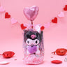 Official Sanrio Kuromi Valentine's Day Plush Gift Set in a clear ribbon package with a red heart balloon. Includes a small Kuromi holding a pink heart and a collectible themed box, perfect for Kawaii aesthetic gift ideas.